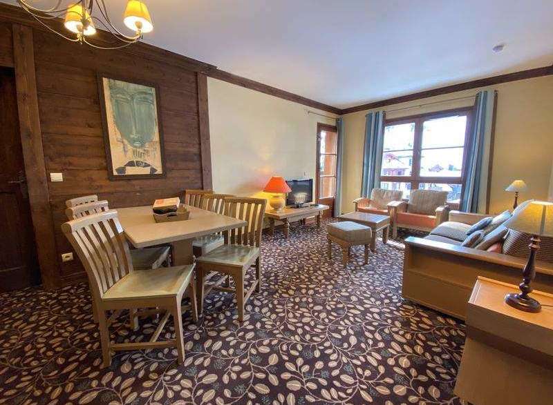 This charming property boasts a cozy living space with a dining area, perfect for relaxing or entertaining.