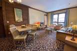 This charming property boasts a cozy living space with a dining area, perfect for relaxing or entertaining.