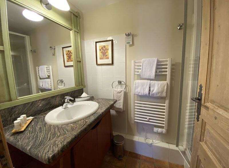 Discover a charming bathroom with a stylish vanity and a sleek sink.