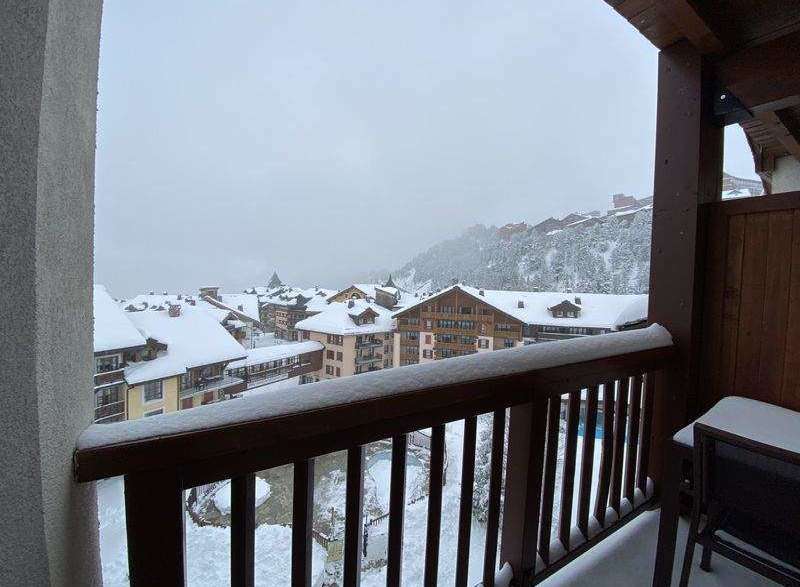 Enjoy breathtaking mountain views from this cozy balcony.