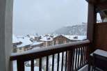 Enjoy breathtaking mountain views from this cozy balcony.