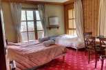 Cozy and inviting, this room features two comfortable beds perfect for a relaxing stay.