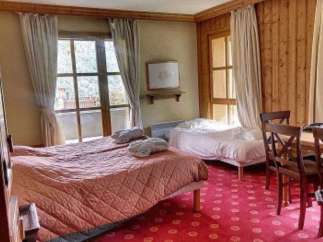 Cozy and inviting, this room features two comfortable beds perfect for a relaxing stay.