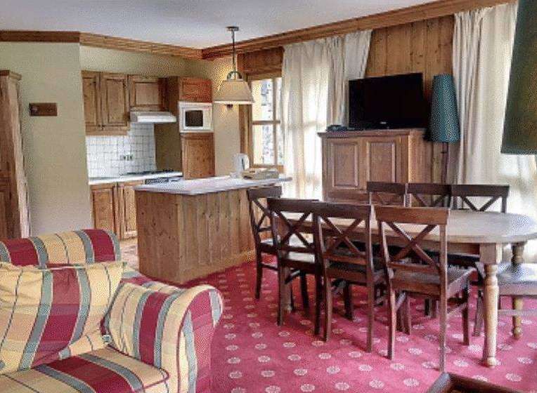 Cozy and inviting living space with a fully equipped kitchen and a comfortable seating area.