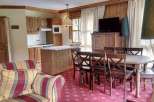 Cozy and inviting living space with a fully equipped kitchen and a comfortable seating area.