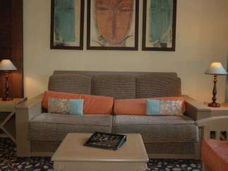 Cozy living room with a comfortable sofa, perfect for relaxation.