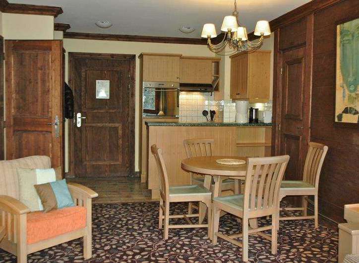 Cozy and inviting, this property features a charming dining area perfect for intimate meals.