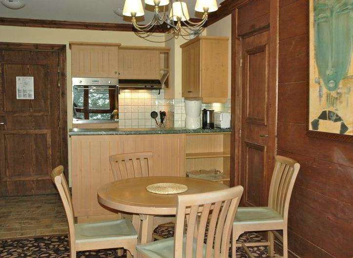 Cozy kitchen and dining area with a rustic charm.