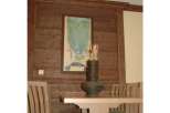 This dining area features a unique wooden wall paneling that adds warmth and character to the space.