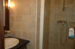 Step into a beautifully tiled bathroom, perfect for a relaxing stay.