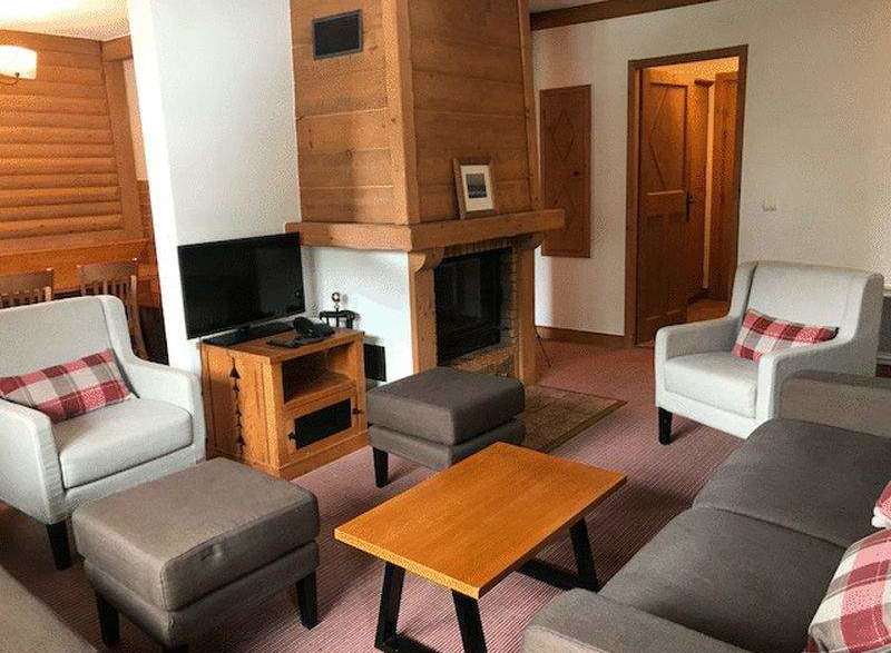 Cozy living room with a fireplace, perfect for relaxing evenings.