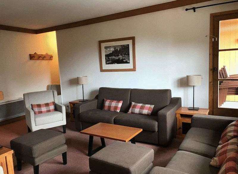 Cozy living room with comfortable seating, perfect for relaxation.