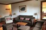 Cozy living room with comfortable seating, perfect for relaxation.