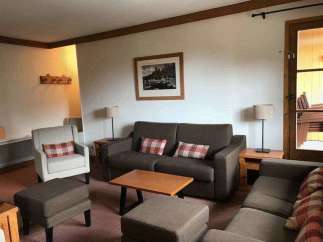 Cozy living room with comfortable seating, perfect for relaxation.