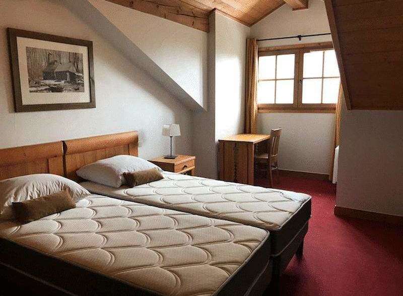 Cozy bedroom with twin beds, perfect for a comfortable stay.