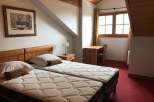 Cozy bedroom with twin beds, perfect for a comfortable stay.
