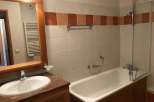 This bathroom features a classic design with a combination of functionality and style.