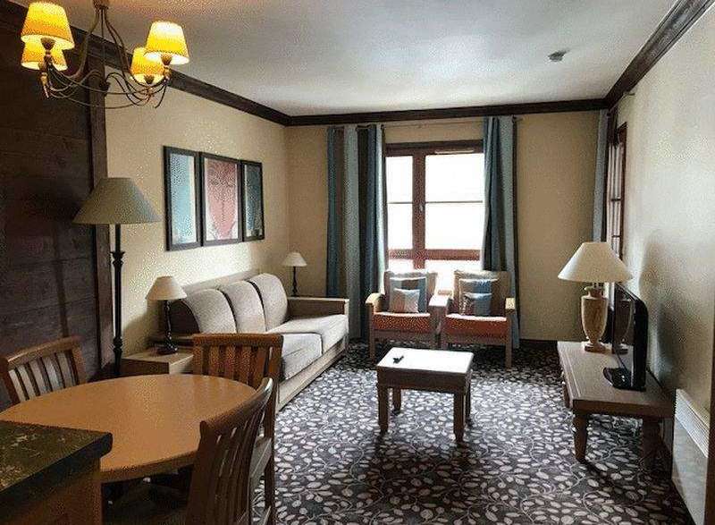 Cozy living space with a comfortable sofa and armchairs, perfect for relaxation.