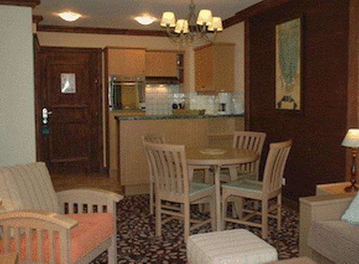 Cozy living space with a dining area and kitchen.