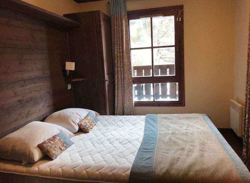 Cozy bedroom with a comfortable bed and inviting atmosphere.