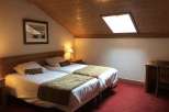 Cozy bedroom with two twin beds, perfect for a comfortable stay.