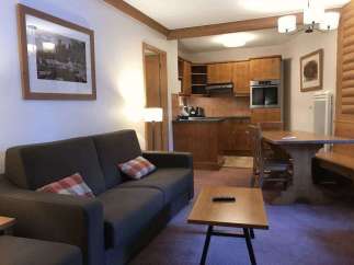 Cozy living space with a comfortable sofa and charming decor.