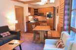 Cozy apartment with a fully equipped kitchen and a comfortable living area.