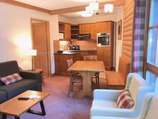 Cozy apartment with a fully equipped kitchen and a comfortable living area.