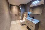 Modern bathroom design featuring a sleek shower enclosure and contemporary fixtures.