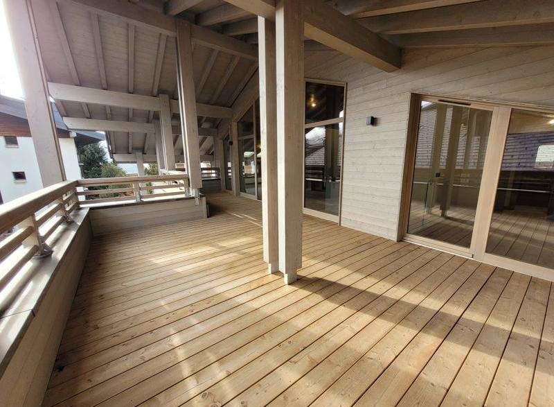 This stunning property boasts a spacious wooden deck, perfect for outdoor relaxation and entertainment.