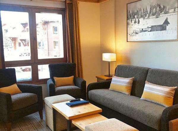Cozy living room with comfortable seating and a charming ambiance.