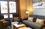 Cozy living room with comfortable seating and a charming ambiance.