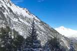 Experience the breathtaking beauty of the mountains in this stunning winter landscape.
