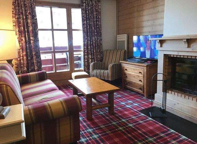 Cozy living room with a fireplace, perfect for relaxing evenings.