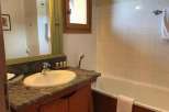 This charming bathroom features a classic design with a touch of rustic elegance.