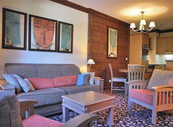 Cozy living room with a comfortable sofa and stylish artwork.