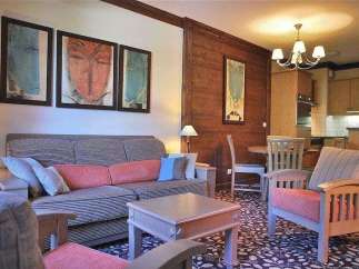 Cozy living room with a comfortable sofa and stylish artwork.