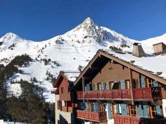 Experience the ultimate ski getaway at this charming mountain chalet.