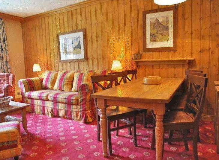 Cozy living space with a charming wooden interior.