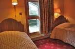 Cozy bedroom with two twin beds, perfect for a comfortable stay.