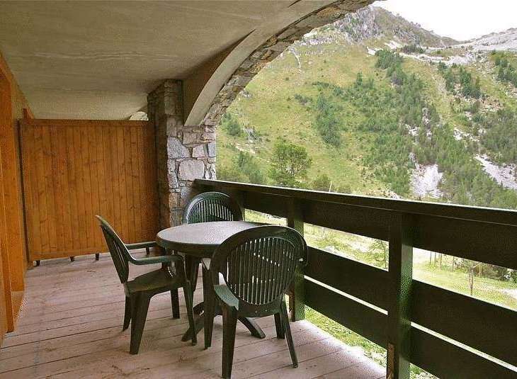 Enjoy breathtaking mountain views from this charming balcony.