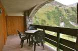 Enjoy breathtaking mountain views from this charming balcony.