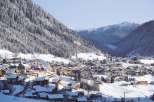 Nestled in a picturesque mountain valley, this charming village offers a serene winter escape.