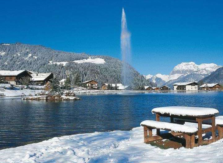 Experience the serene beauty of this lakeside property, perfect for a winter getaway.