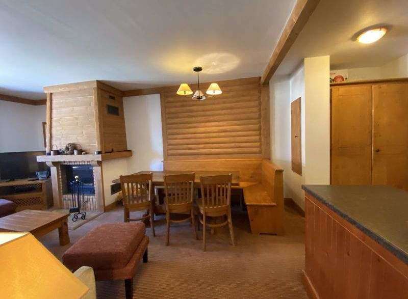 Cozy up in this charming living space! Featuring a rustic fireplace, perfect for those chilly evenings.