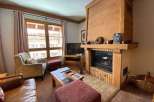 Cozy up in this charming living space, complete with a rustic fireplace and inviting ambiance.