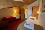 Cozy bedroom with two single beds, perfect for a comfortable stay.