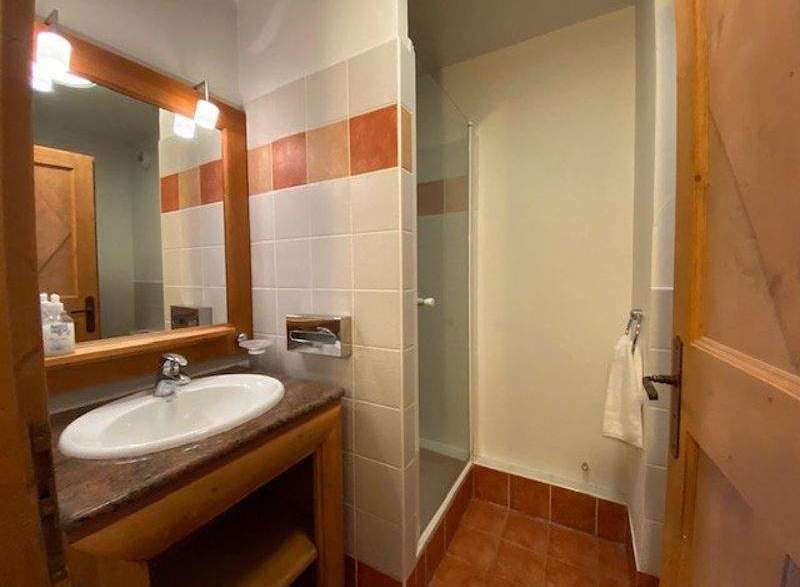 This charming bathroom features a stylish sink and vanity, perfect for your daily routine.