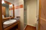 This charming bathroom features a stylish sink and vanity, perfect for your daily routine.