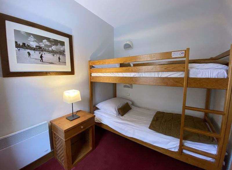 Cozy bedroom featuring a bunk bed, perfect for families or groups.